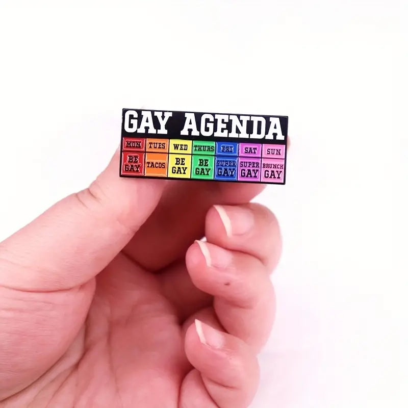 Hand view with Funny Gay Agenda Pin for LGBTQ+ Pride